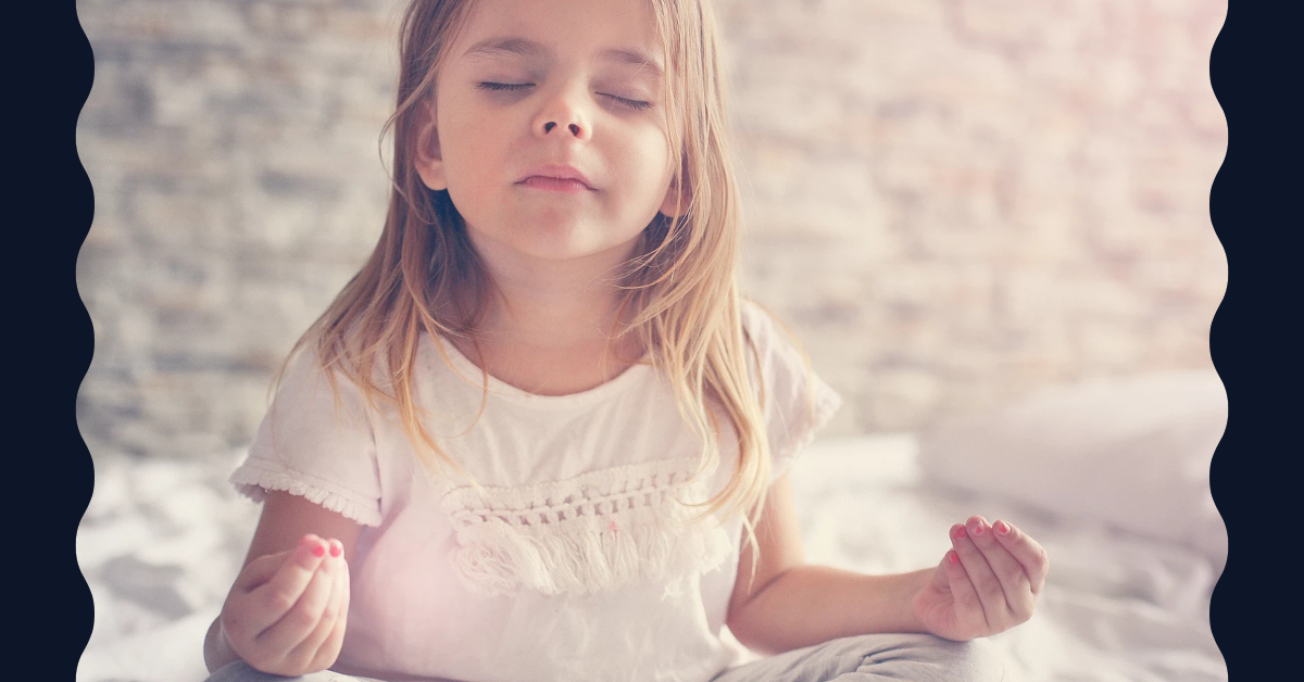 Little girl meditating with eyes closed