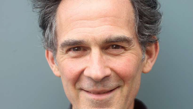 Close-up portrait of a smiling man, UK.