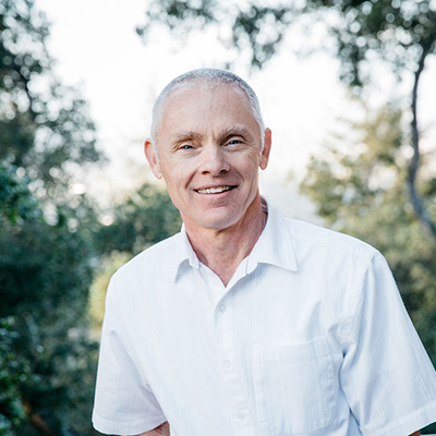 Portrait of a smiling middle-aged man outdoors